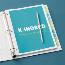 Use binders and dividers for a more flexible way to update information in employee handbooks than bound books.