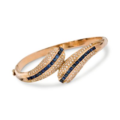 C. 1970. Vintage 1.50 ct. t.w. Diamond and 2.75 ct. t.w. Sapphire Bypass Hinged Bangle Bracelet In 1