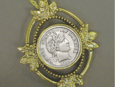 Pendiente con hojas y moneda Barber de diez plateada