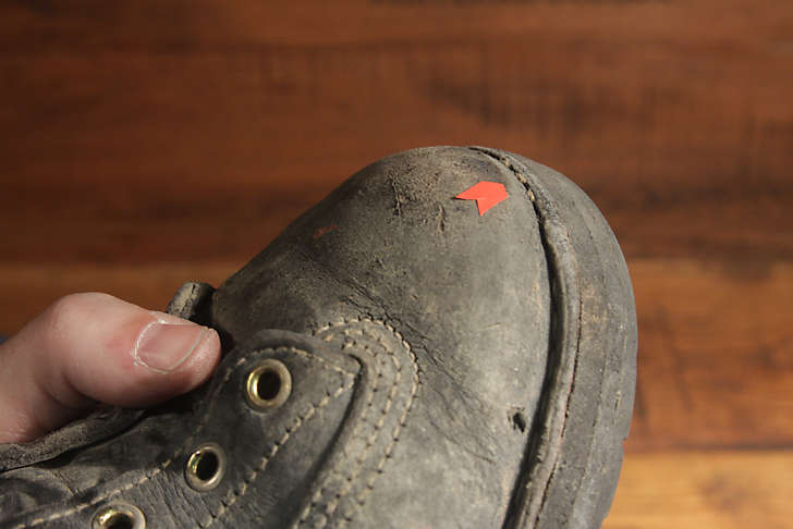 boot with welt and outsole worn off
